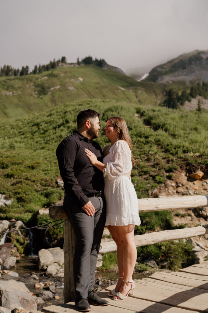 Couple standing on Myrtle Falls bridge at Mount Rainier National Park.