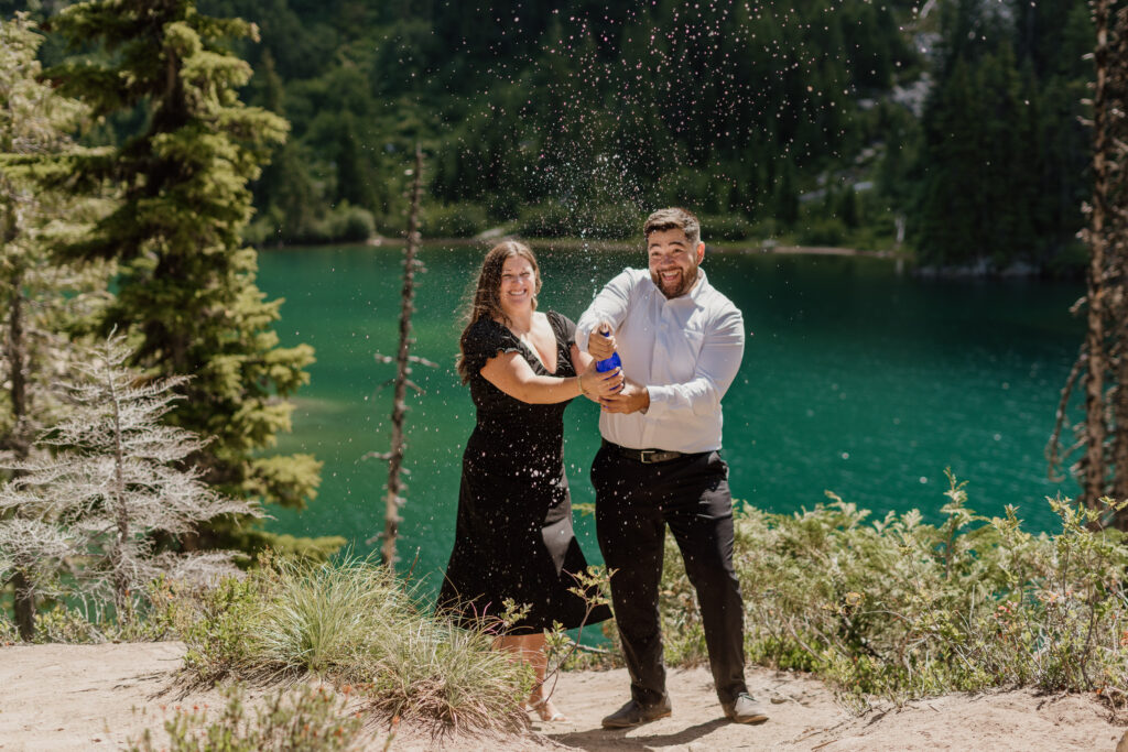 Couple doing a "Champagne pop" at Mount Rainier National Park.