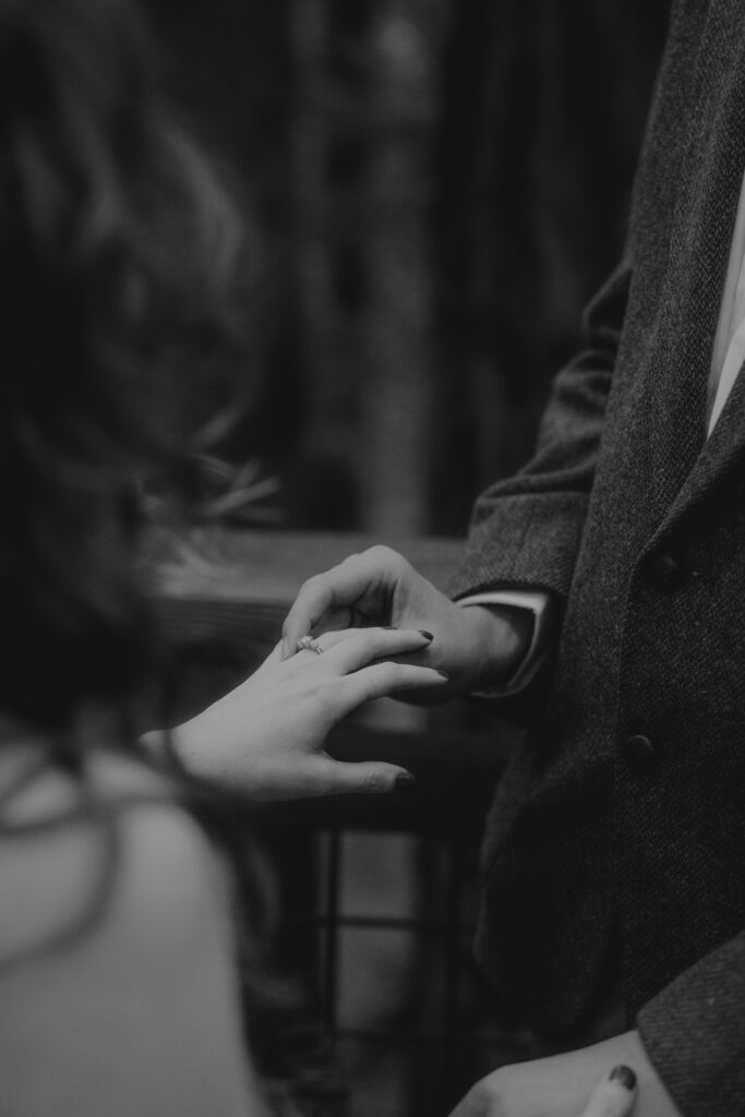 Ring exchange during a Redwood Deck Elopement at Hoyt Arboretum.