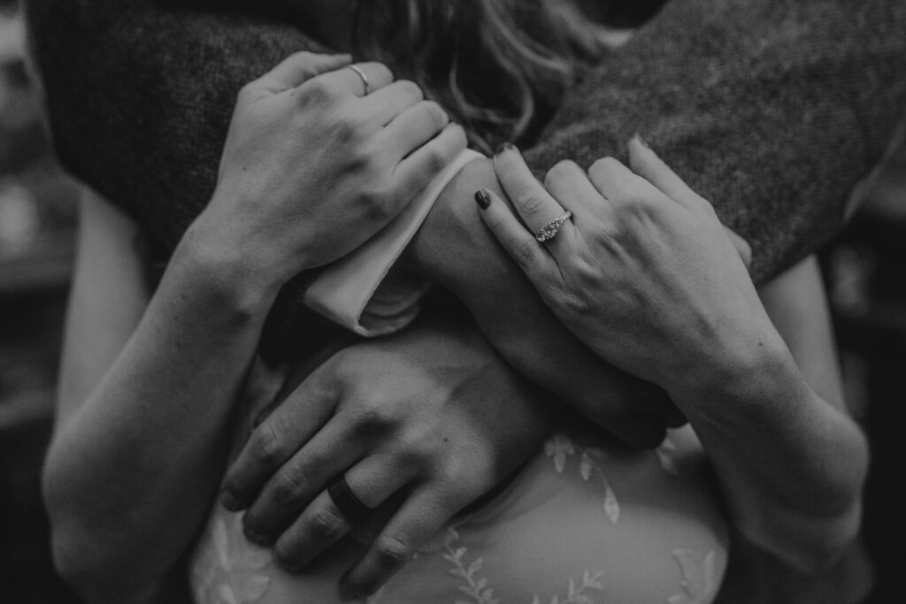 close up of couples hands with their wedding rings on after they exchanged vows at the Redwood Deck during their elopement.