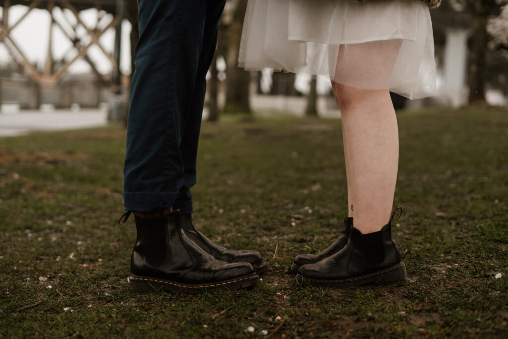 Photo of a couples feet both wearing Doc Marten boots after their Multnomah County Courthouse Elopement in Portland, Oregon.