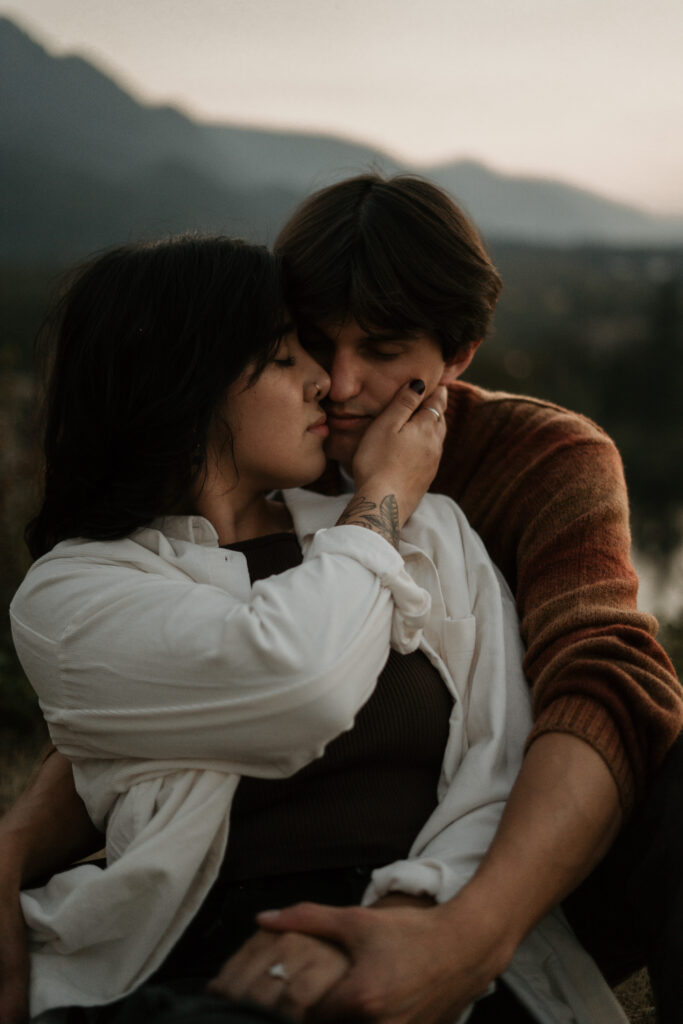 Couple posing snuggled into eachother for their Columbia River Gorge engagement photos.