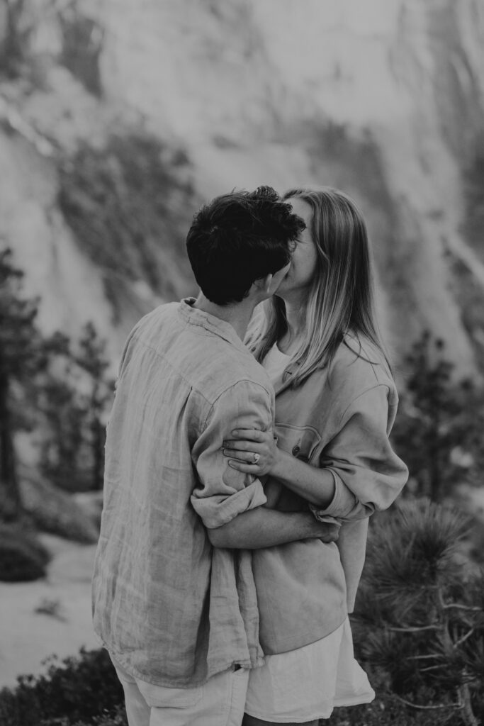 Black and white photo of couple kissing after a Yosemite NP proposal.