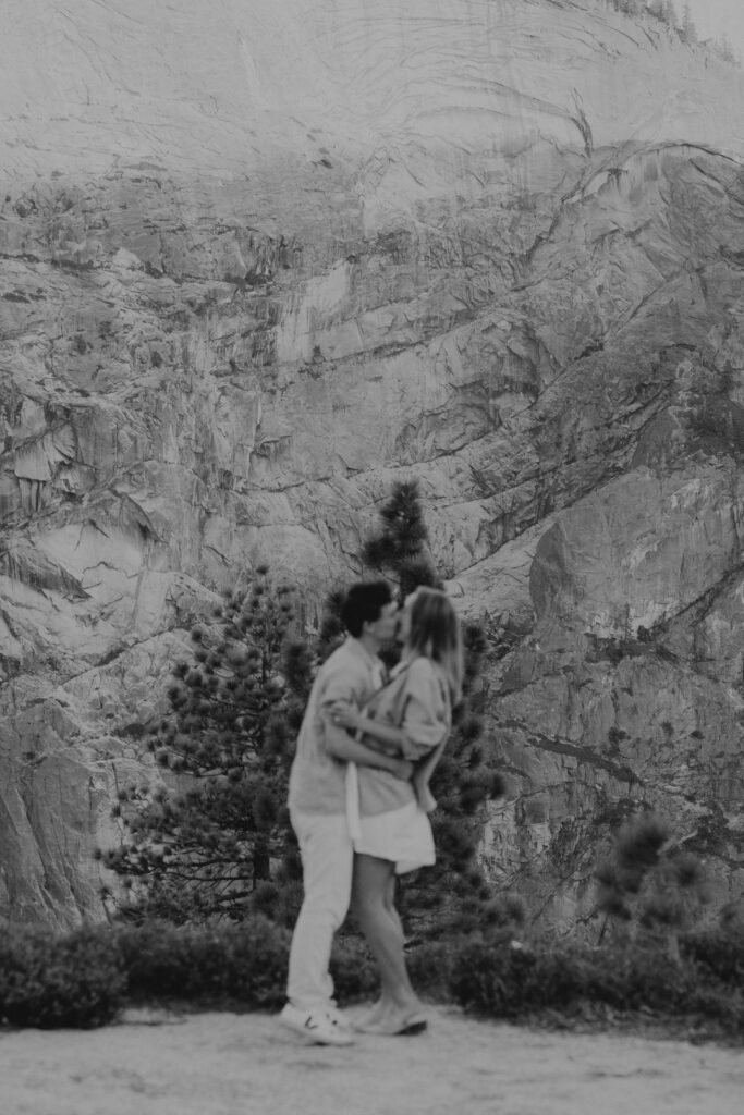 Film aesthetic photo of couple in Yosemite National Park after a proposal.