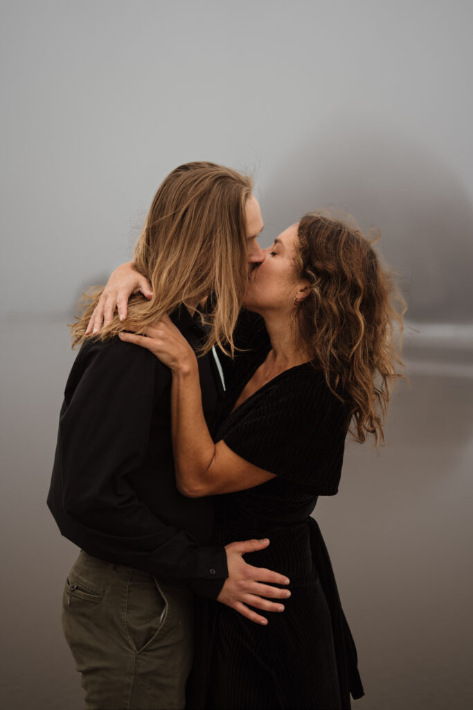 Couple kissing during their pre-elopement engagement session on the Oregon Coast.