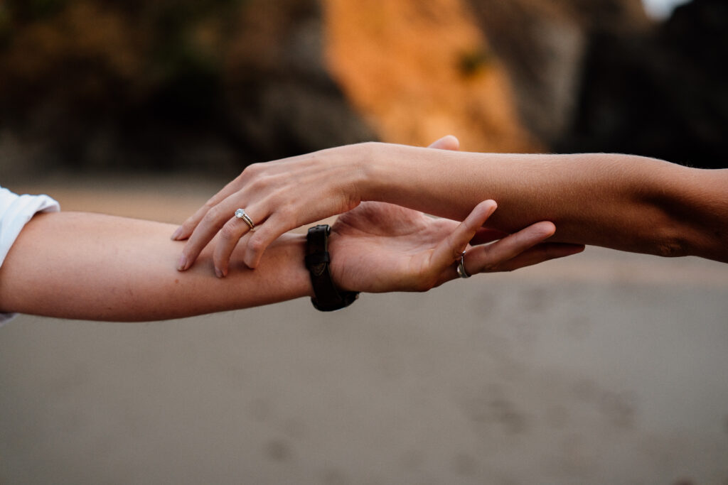 Intimate hand photo taken at Secret Beach during the couples Samuel H Boardman elopement.