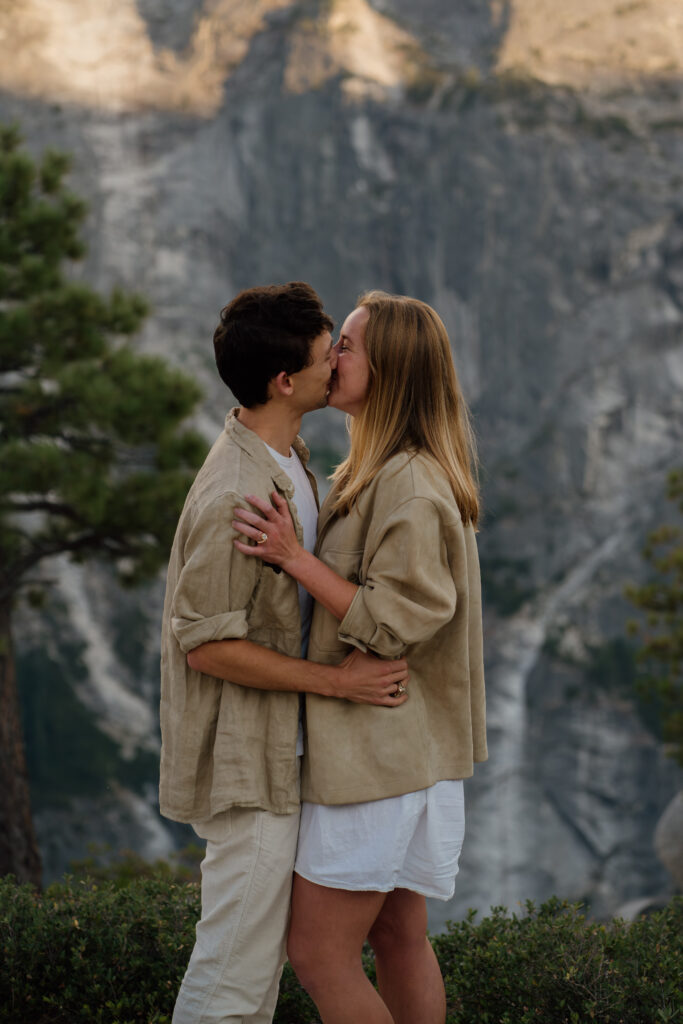 Couple kissing during their engagement session at Yosemite National Park