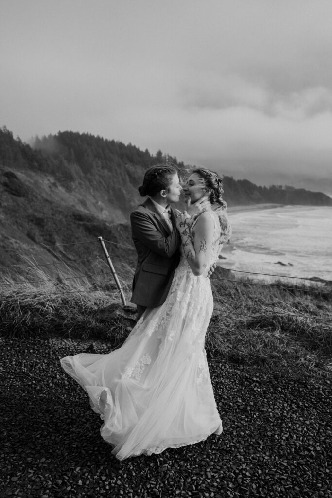 Couple about to kiss at an Ecola State Park Overlook.