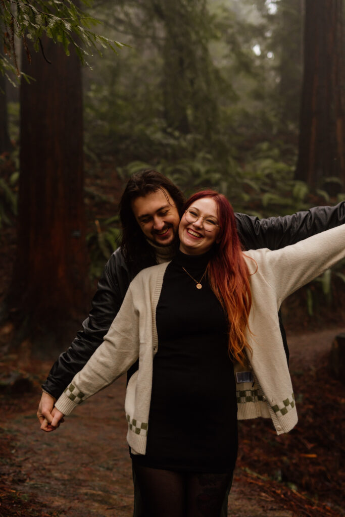 Couple laughing during their engagement session.