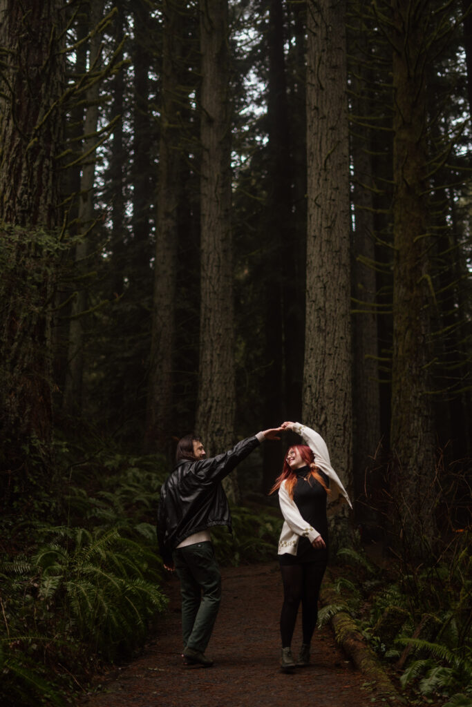 Couple twirling while dancing during their Portland Oregon Engagement Session.