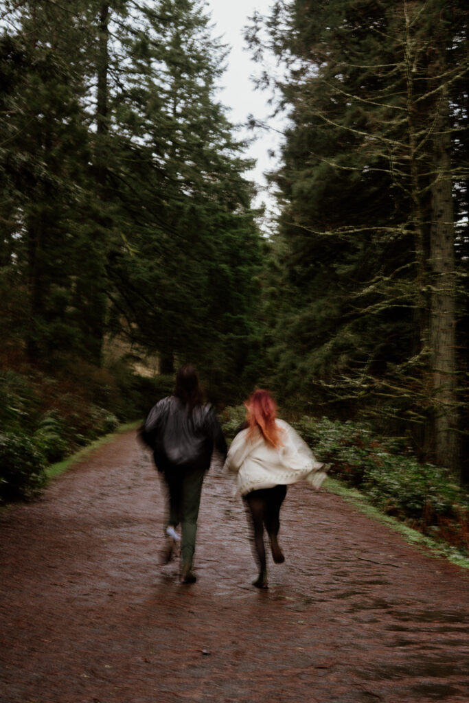 Couple running away from camera during their engagement session.