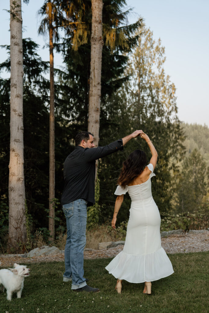 Couple twirling during their Seattle Engagement photos.