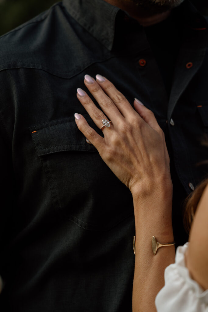 Close up photo of engagement ring during a couples seattle engagement shoot.