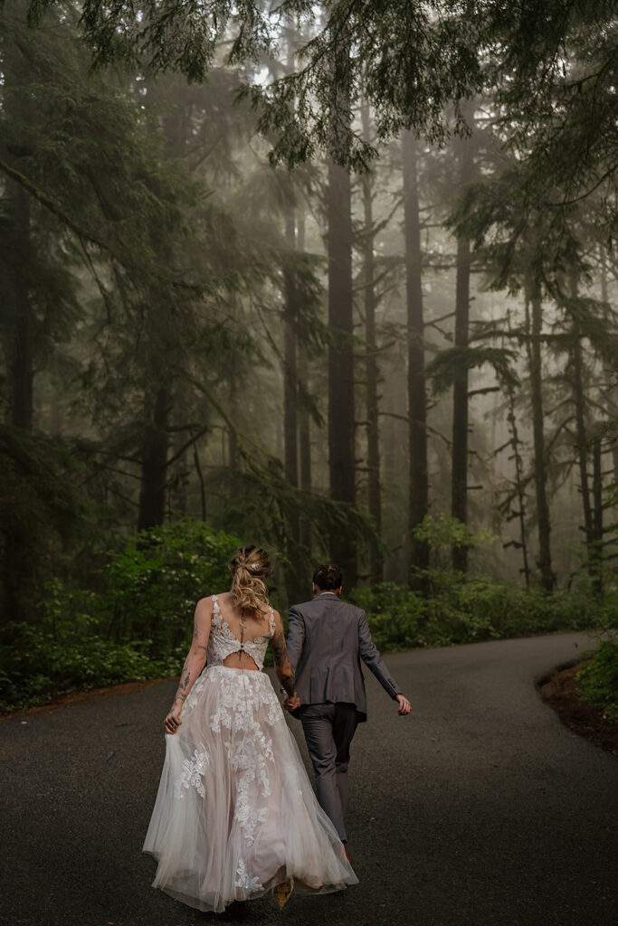 Brides walking through Ecola State Park forest