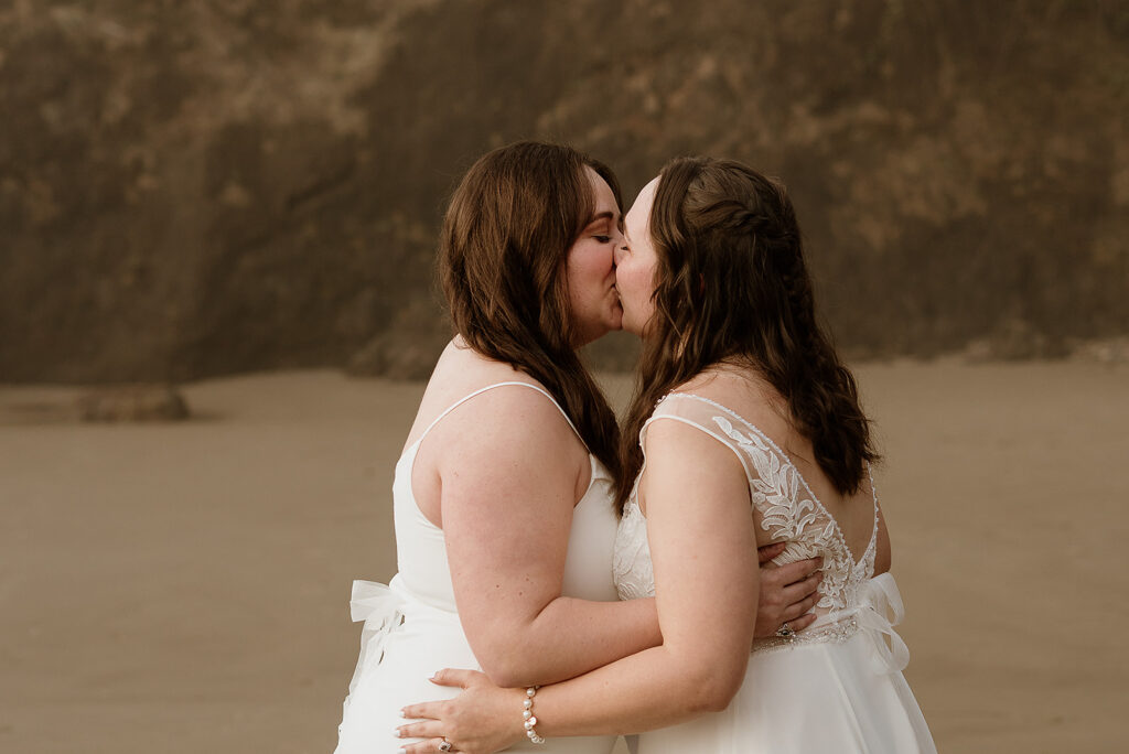 L and C's first kiss after their beach micro wedding ceremony 