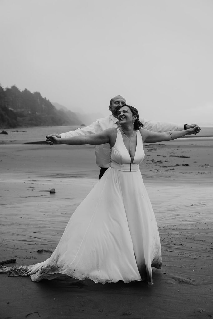 Bride and groom dancing together on Arcadia Beach