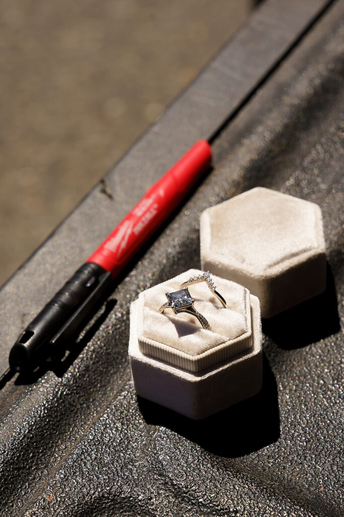 A's ring sits next to the marker on the truck bed that she uses to draw S's ring