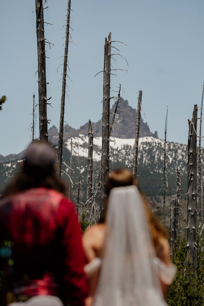 Blurry bride and groom with a mountain in the backdrop