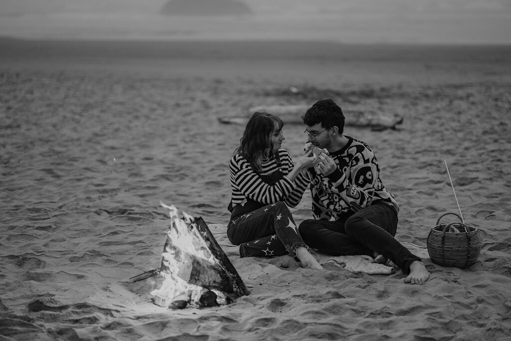 Oregon engagement photos by a bonfire at Hug Point