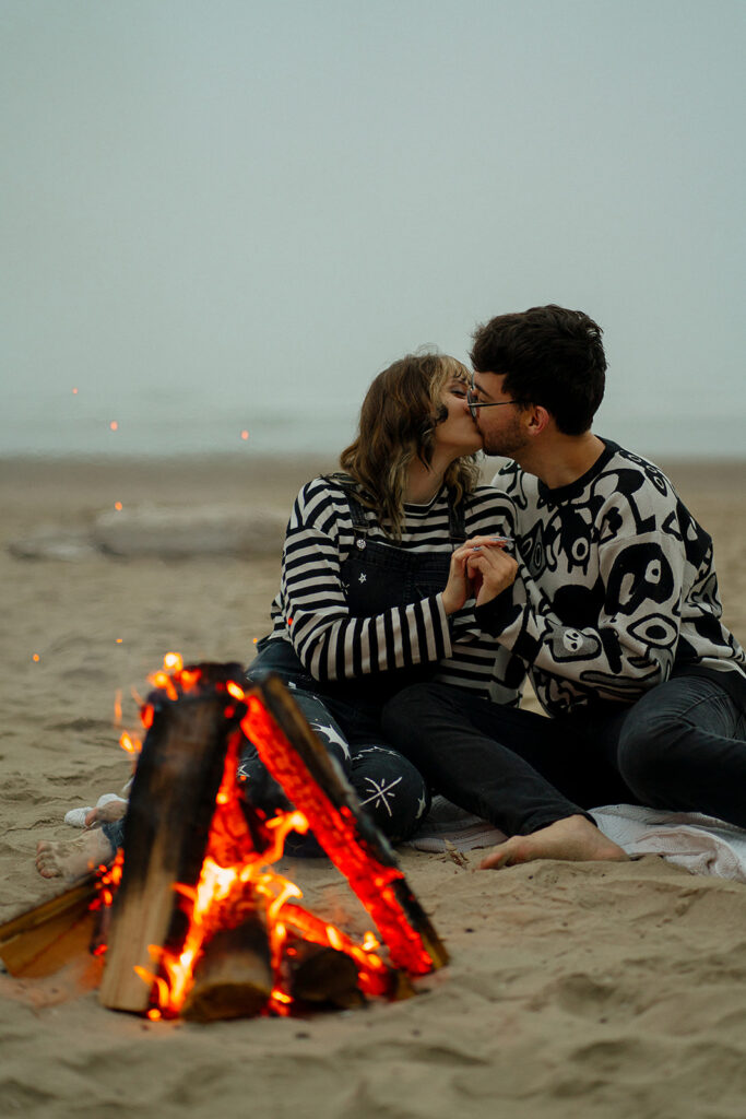 Oregon engagement photos by a bonfire at Hug Point