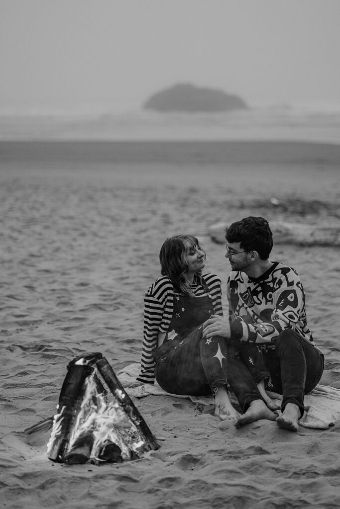 Oregon engagement photos by a bonfire at Hug Point