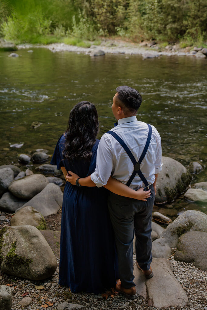 Couple stands near Old Salmon River Trail for their outdoor photoshoot in Mount Hood National Forest