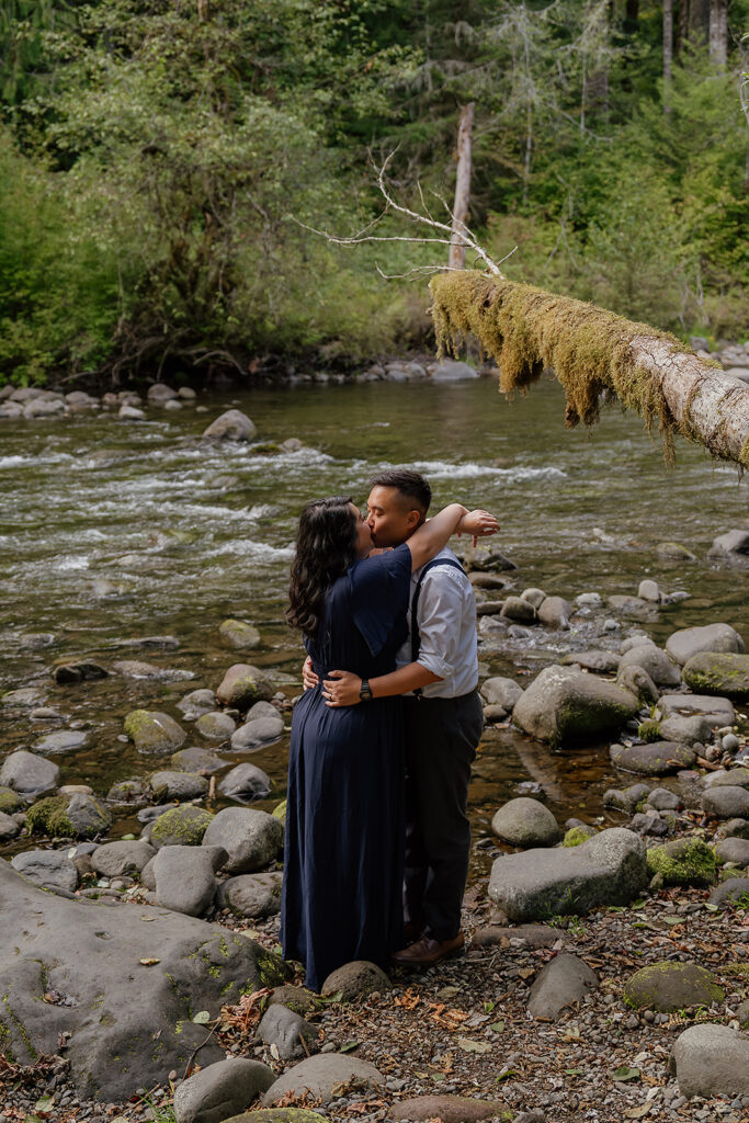 Couple kissing near Old Salmon River Trail for their outdoor photoshoot in Mount Hood National Forest