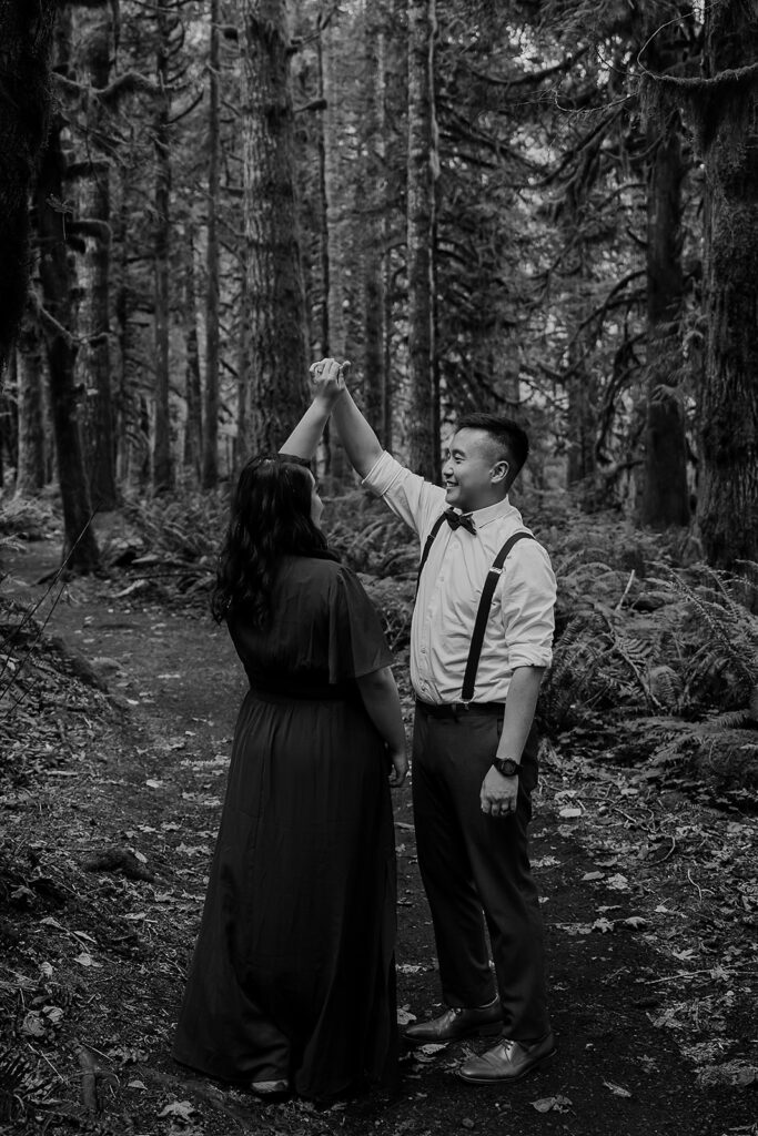 A couple dances around in Mount Hood National forest during their outdoor session