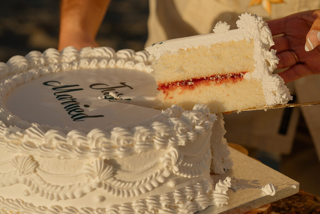 Bride and groom cut into a white wedding cake after their Oregon micro wedding ceremony