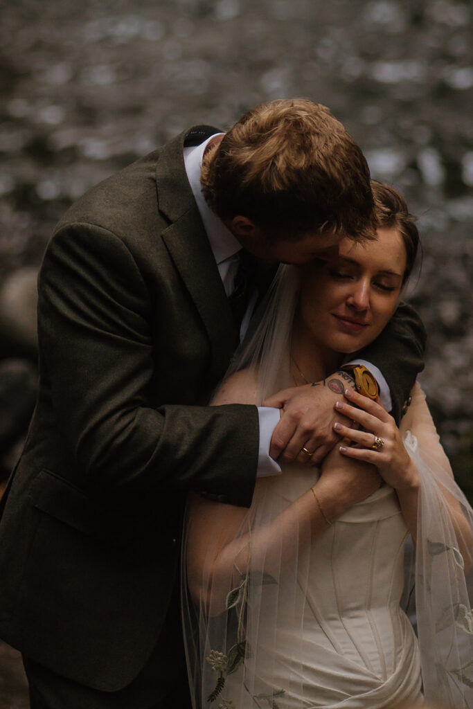 Waterfall bride and groom portraits at Wahclella Falls in the Columbia River Gorge