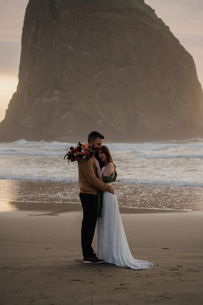 Cannon Beach bridal portraits with Haystack Rock in the backdrop