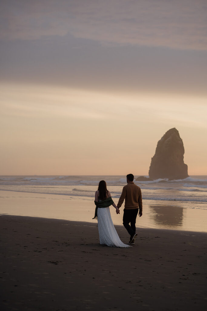 Cannon Beach bridal portraits with Haystack Rock in the backdrop