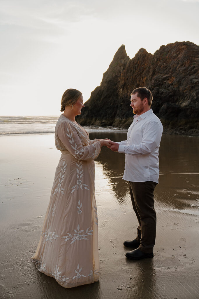 Bride and groom hold their elopement ceremony on the Oregon Coast near Cannon Beach