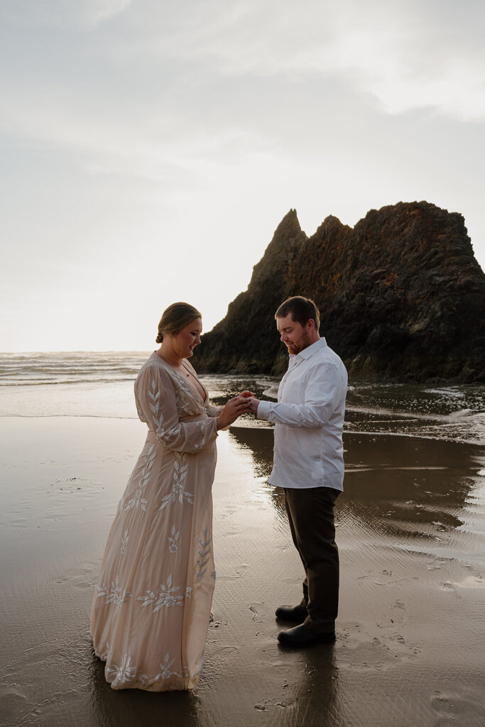 Bride and groom hold their elopement ceremony on the Oregon Coast near Cannon Beach