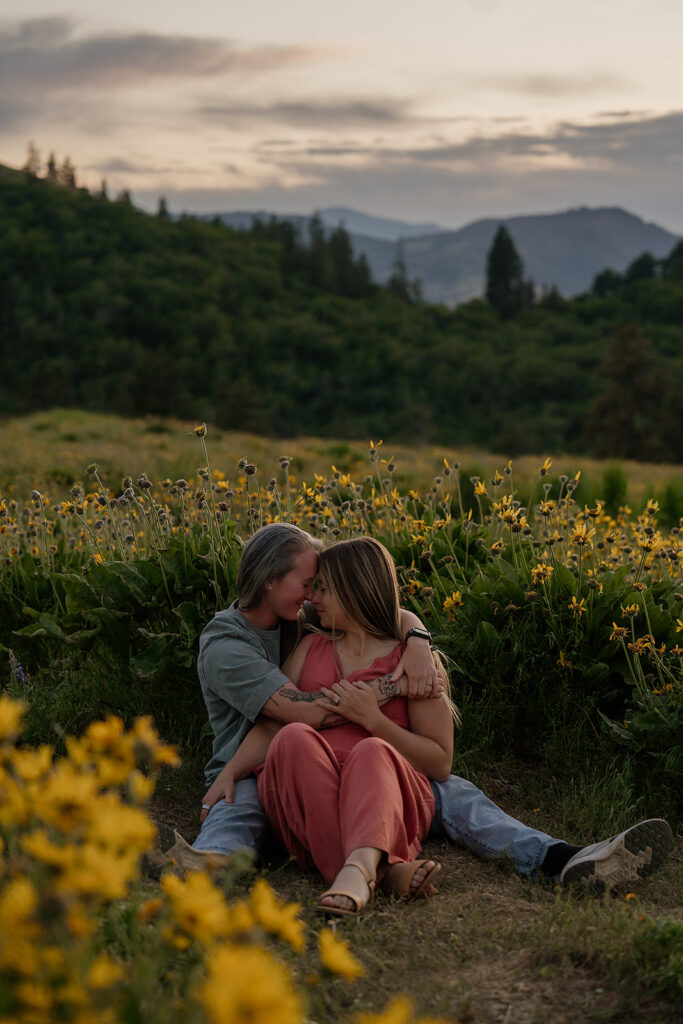Sunset couple pictures in Oregon surrounded by wildflowers