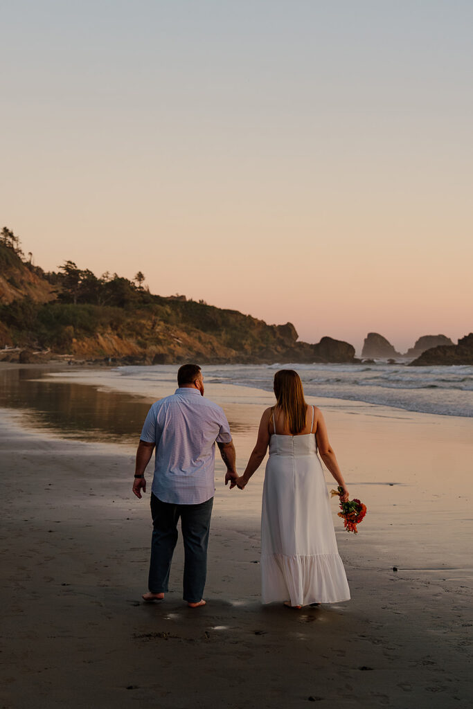 Couple gets sunset portraits during their Cannon Beach honeymoon