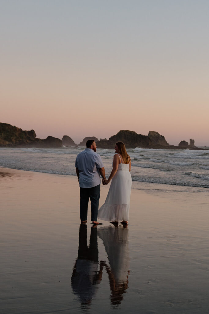 Couple gets sunset portraits during their Cannon Beach honeymoon
