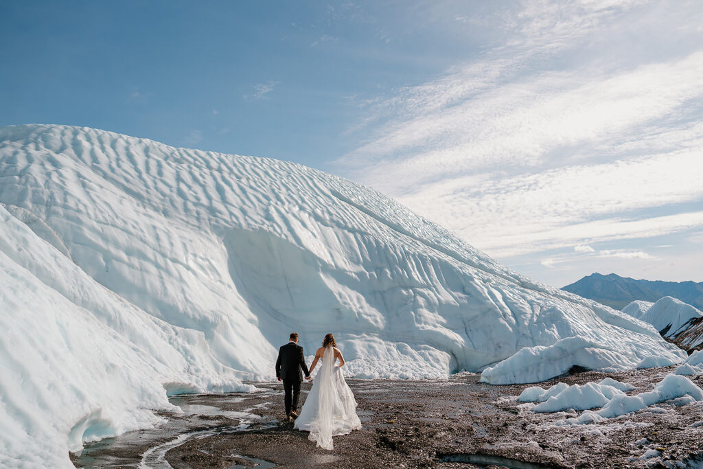 Bride and groom hike to Matanuska Glacier in Alaska for their elopement ceremony
