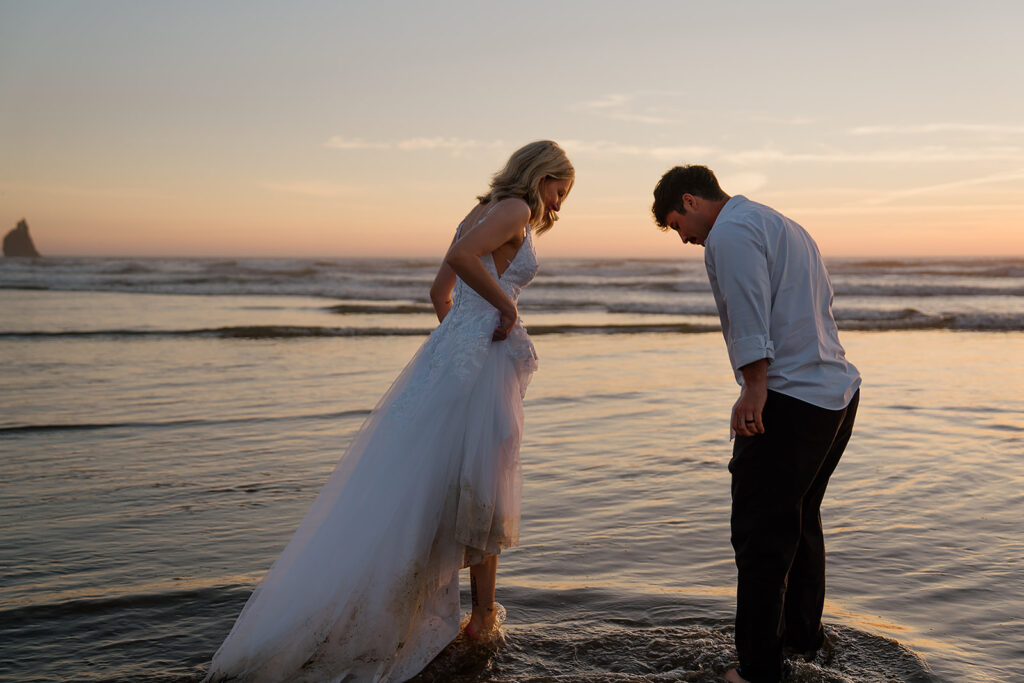 Cannon Beach wedding photos in the ocean at sunset
