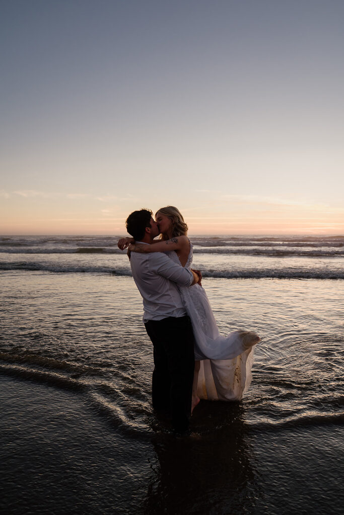 Cannon Beach wedding photos in the ocean at sunset