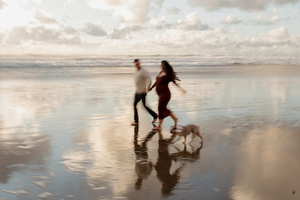 Sunset beach maternity pictures on the Oregon Coast with their pup
