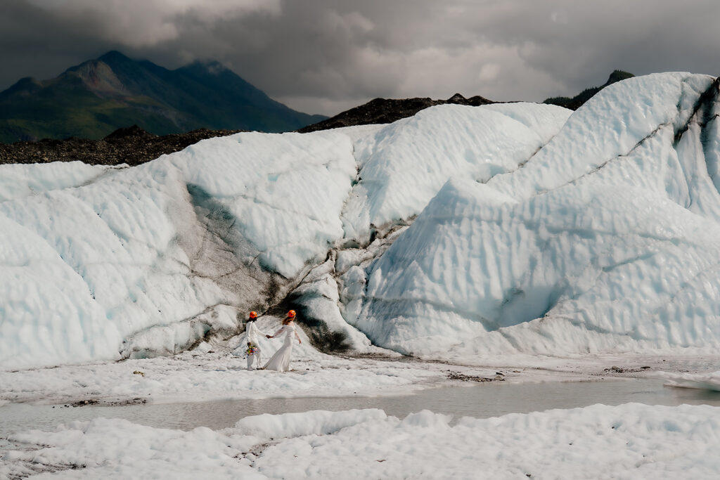 Couple hikes around on Matanuska Glacier after their elopement ceremony