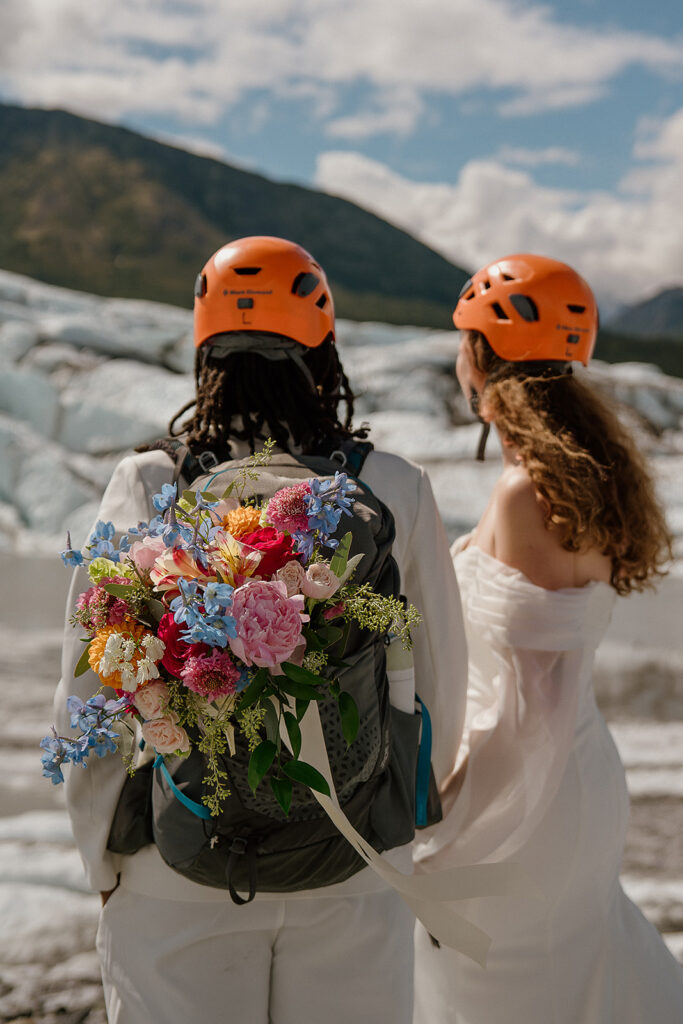 Couple hikes around on Matanuska Glacier after their elopement ceremony