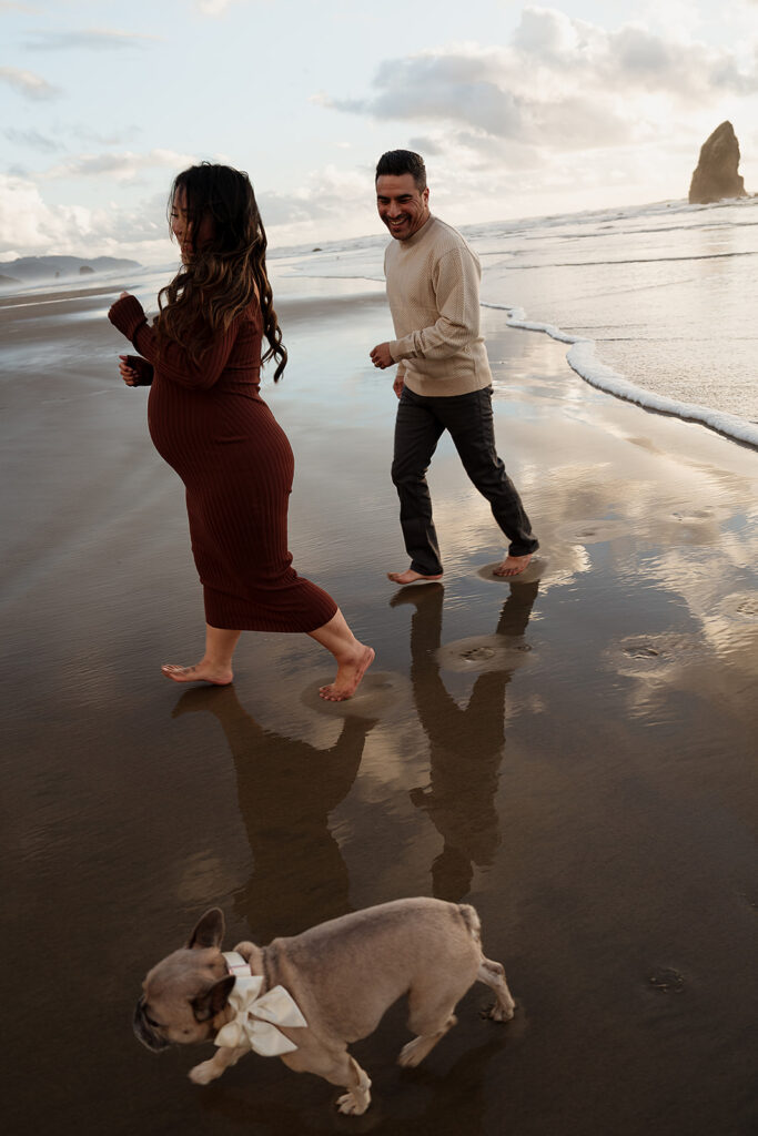 Sunset beach maternity pictures on the Oregon Coast with their pup