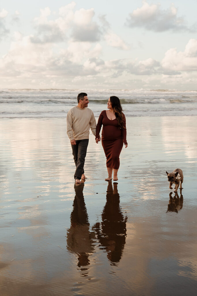 Sunset beach maternity pictures on the Oregon Coast with their pup