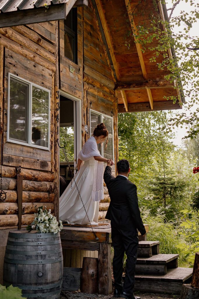 Alaska cabin elopement photos of bride and groom