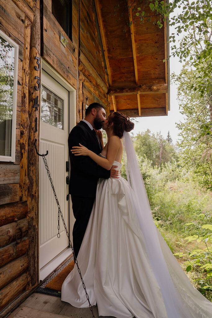 Alaska cabin elopement photos of bride and groom