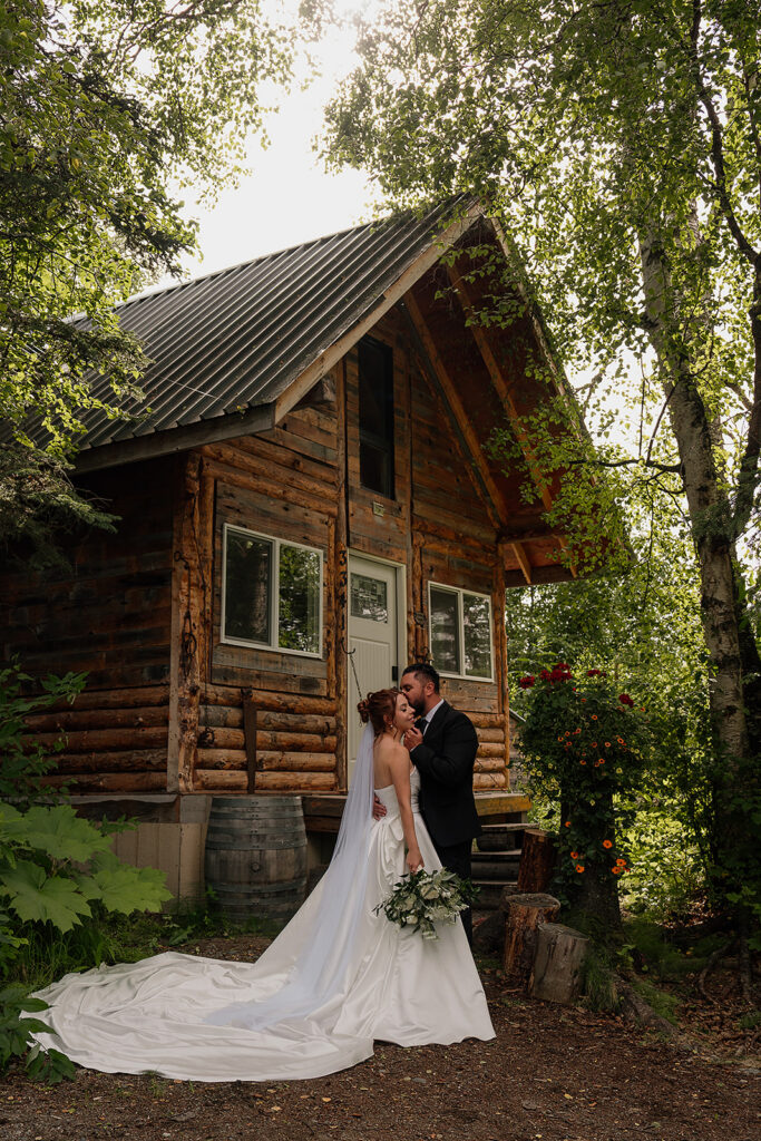 Alaska cabin elopement photos of bride and groom