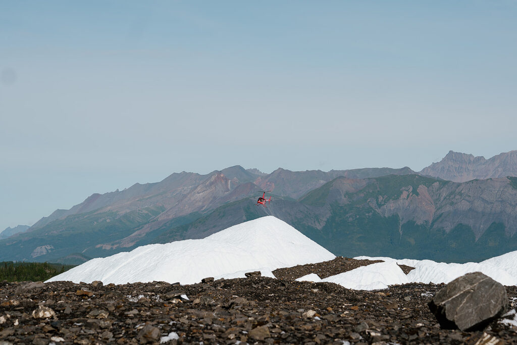 Helicopter flies over Matanuska Glacier