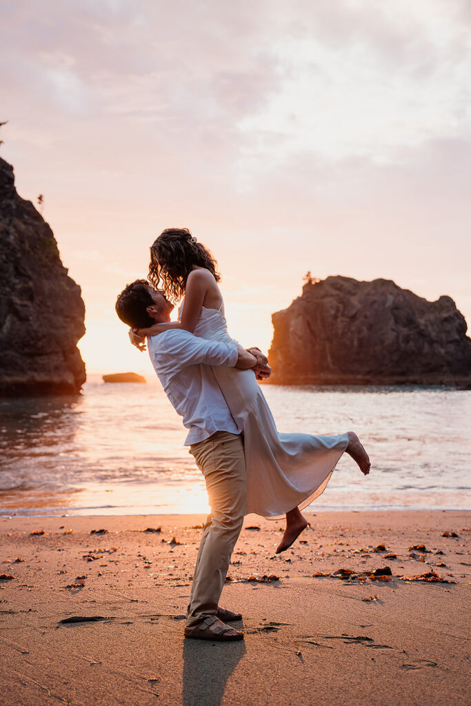 Couple on the Oregon Coast beaches at sunset